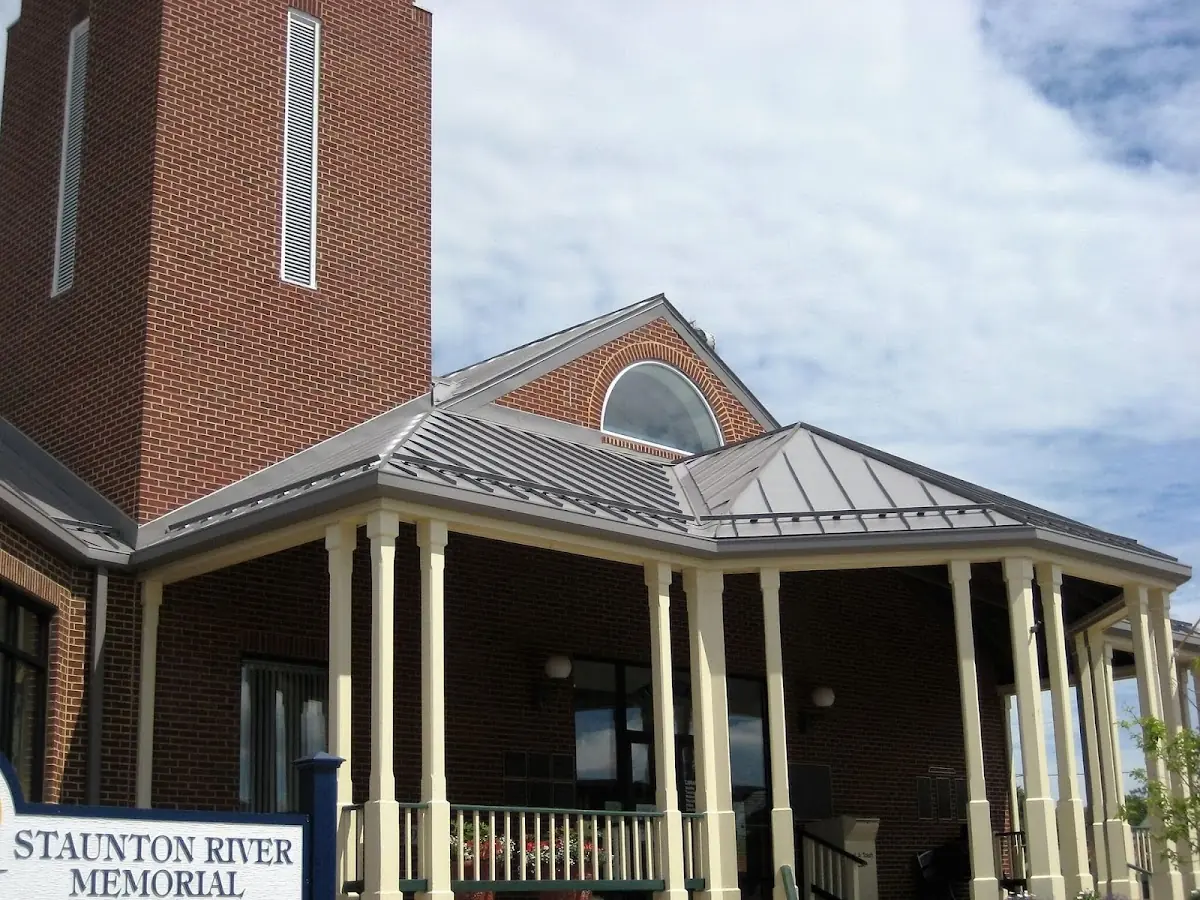 Skilled roofing craftsmen working on a residential roof in O'Fallon